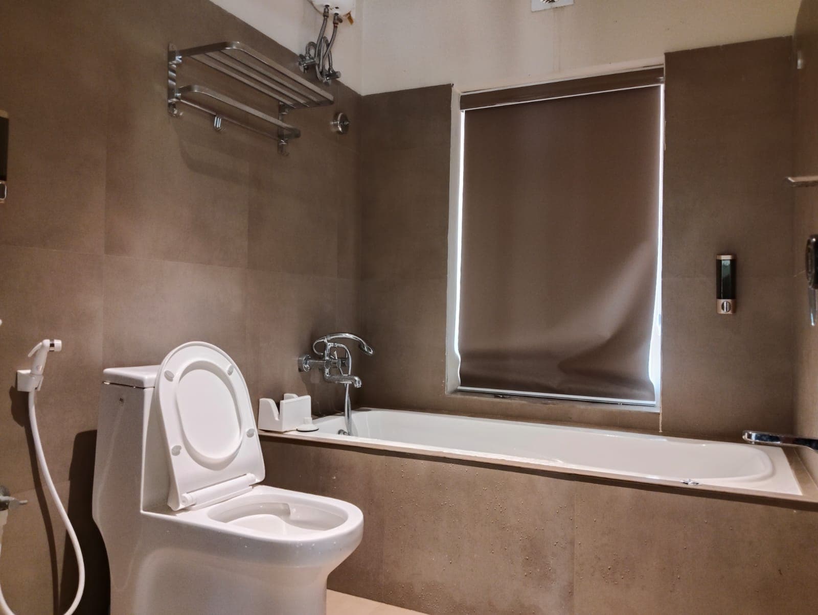 Upper suite luxury ensuite bathroom featuring deep soaking bathtub